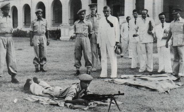 Prime Minister D. S. Senanayake watching the Ceylon Light Infantry training.