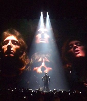 Williams on stage in Poland in 2015 performing "Bohemian Rhapsody". He collaborated with Queen in recording "We Are the Champions" for the 2001 film A Knight's Tale