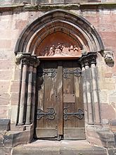 Portail latéral gothique avec tympan néo-roman "Les trois Rois Mages" (1844)