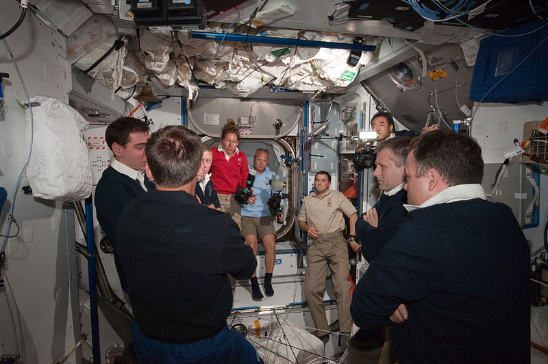 File:STS-135 and Expedition 28 crews after the hatch opening.jpg