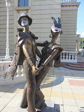 Carnival masks on bronze sculptures before the entrance to the Macedonian National Theater in Skopje city, North Macedonia