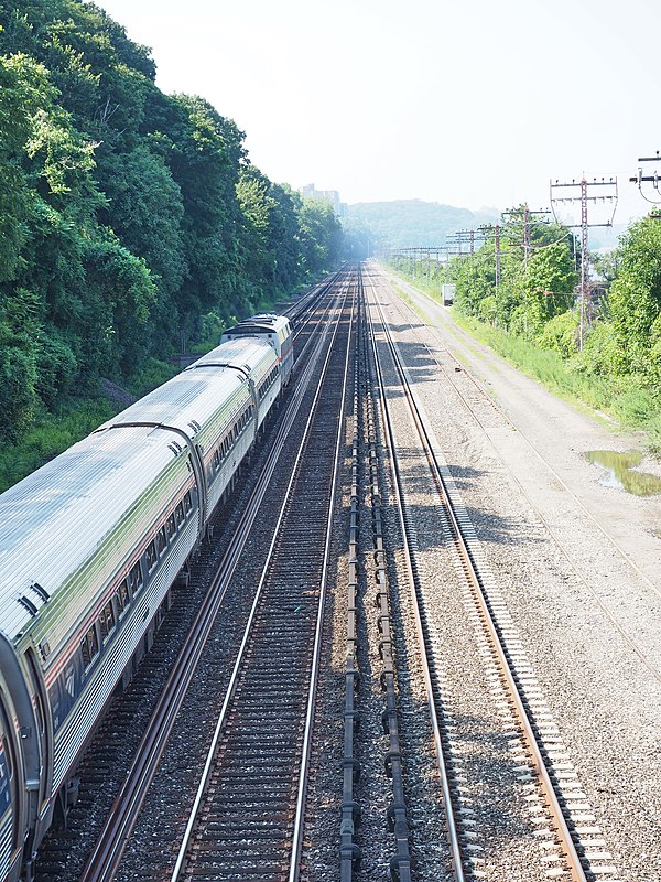 Southbound Amtrak train on Hudson line tracks, just south of Riverdale Station. Looking south from 254th street bridge, Riverdale, Bronx, NY