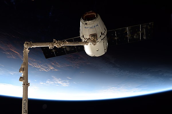 SpaceX CRS-12 Dragon grappled by the ISS Canadarm2.jpg