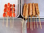 Grilled sausages on sticks for sale in Thailand