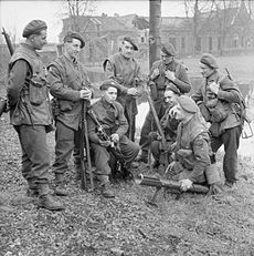 A fighting patrol of the 1/4th Battalion, KOYLI in North West Europe. Armed with rifles, Bren gun, Sten guns and a PIAT, Elst, 2 March 1945. The British Army in North-west Europe 1944-45 B15008.jpg
