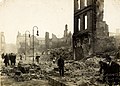 Workers clearing rubble in Cork following the fires