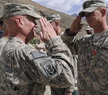 Drew salutes Scott Doyon of Clinton, Maine after presenting Bronze Star Medal, Oct. 21, 2010. Thomas E. Drew Afghanistan.jpg