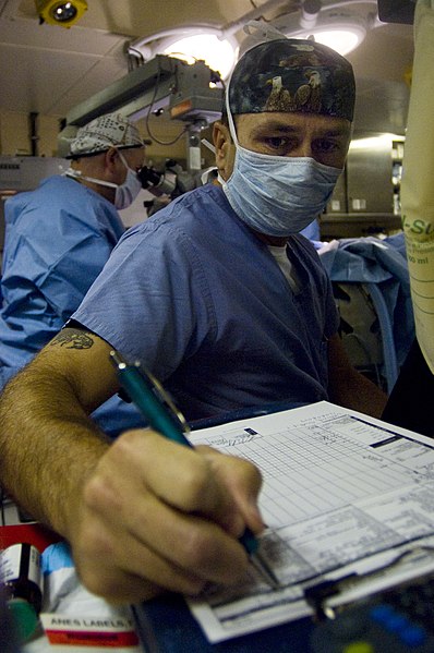 File:US Navy 080816-N-9620B-001 Lt. Cmdr. Clyde Martin keeps track of surgical procedures during an eye surgery procedure on an elderly Nicaraguan woman aboard the amphibious assault ship USS Kearsarge (LHD 3).jpg