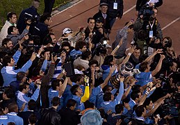 Uruguay players with CA trophy.jpg