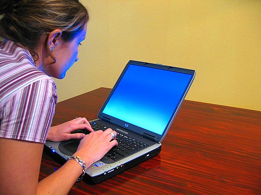 Woman-typing-on-laptop