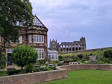 YHA Whitby opened at its current location in 2007 YHA Whitby and Abbey.jpg