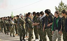 Women's Protection Units in November 2014 YPJ fighters shake hands with one another.jpg