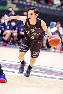 colour photograph of Yuki Kawamura playing basketball