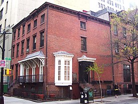 An unfounded local legend claims that writer Washington Irving, for whom Irving Place is named, lived in the house in the foreground house, 122 East 17th Street, also known as 49 Irving Place; also in the photo is 47 Irving Place. 122 East 17th Street 49 Irving Place.jpg