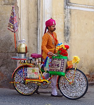 Man with bicycle on a street of Jaipur