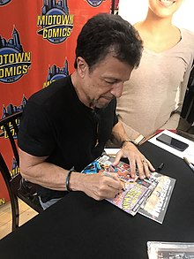 Artist John Romita Jr. signing a copy of The Amazing Spider-Man #238, in which the Hobgoblin first appeared, at Midtown Comics in Manhattan