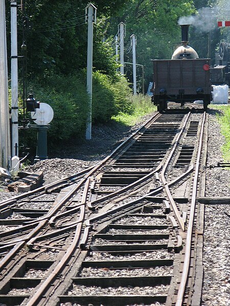 A broad-gauge train on mixed-gauge track