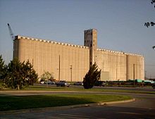 A 1928 Burrus Elevator steel-reinforced concrete elevator with 123 silos shown just prior to demolition in 2004 Burrus.JPG