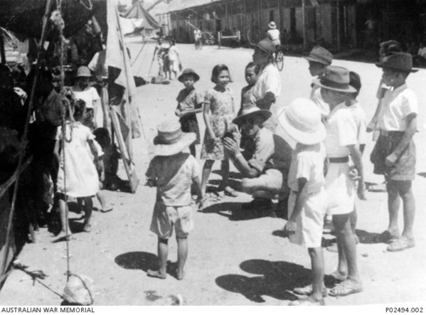 North Borneo children being filmed by an Australian government representative a year after the war in 1946