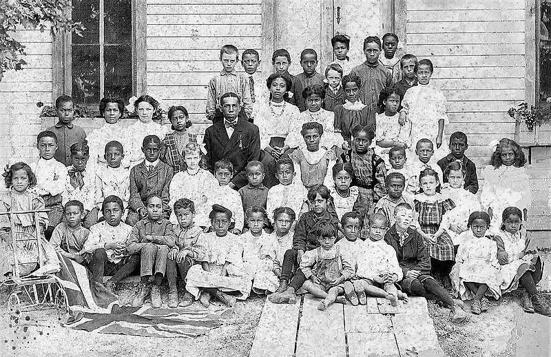 File:Class of 1909-1910 - in front of the only school in Canada built by fugitive slaves.jpg