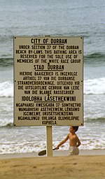 Durban beach sign in English, Afrikaans, and Zulu, declaring the beach "Whites only" DurbanSign1989.jpg