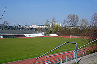 Association football pitch,surrounded by running track
