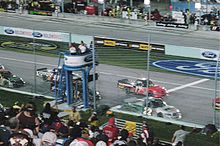 The field for the Ford 200 getting the one to go signal from the flag stand during pace laps before the race. Ford 200 Grid.jpg