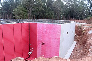 A Formosan termite and waterproofing barrier installed on a foundation in Greenville, SC Foundation barrier Greenville SC.jpg