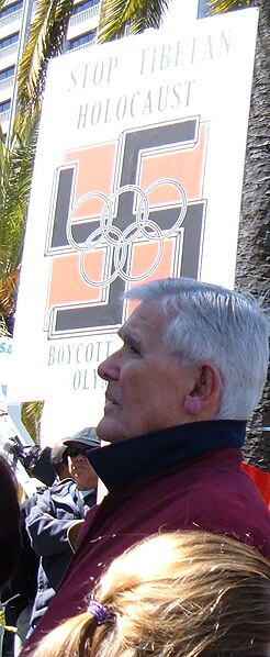 File:Genocide claims with Oympics symbol, swastika, and boycott, 2008 Olympic Torch Relay in San Fransisco, the Embarcadero (cropped).JPG