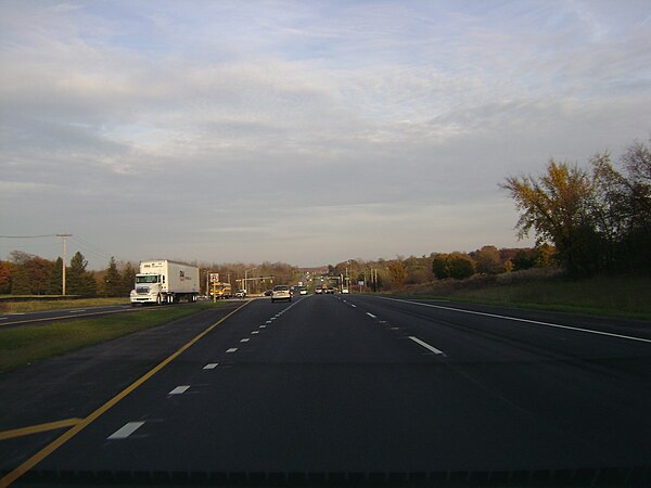 Eastbound IL 120 approaching Hunt Club Road on divided highway section.