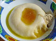 Asida is Libya's traditional breakfast. It consists of a cooked wheat flour lump of dough, sometimes with added butter, honey, or date syrup. Libyan Asida.jpg