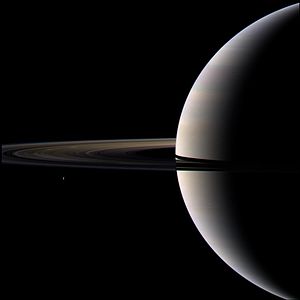 Looking cool and serene, Saturn shares its soft glow with Cassini.jpg