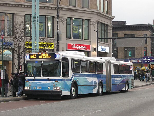 A Bx12 SBS bus stopped at Fordham Plaza near Fordham Place in 2009