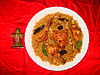 The national dish machboos consists of rice with meat (on this plate chicken), onions and spices