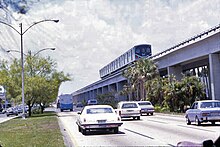 Northbound Metrorail traveling above South Dixie Highway Miami's Metrorail traveling above the traffic.jpg