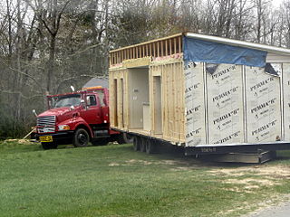 A mobile home being prepared for transport