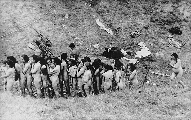 Naked Jewish women from the Mizocz ghetto wait in a line before their execution by the Order Police with the assistance of Ukrainian auxiliaries.