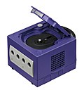 A GameCube with disk bay open.