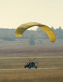 A powered paraglider trike landing