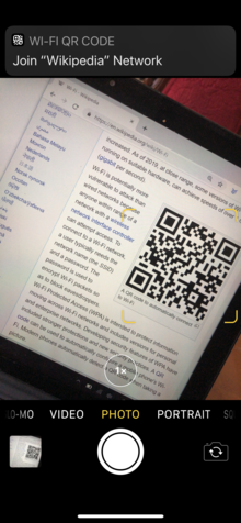 A pop-up in the top of the screen after the camera recognizes a QR code QR code Wi-Fi mobile phone camera auto recognition.png