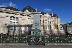 Memorial to Jules Méline (foreground) and Bibliothèque de Maxonrupt (background) in Remiremont, France