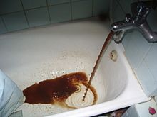 Interior rust in old galvanized iron water pipes can result in brown and black water Rust from bathtub in Kyiv.jpg