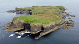 Aerial view of Staffa, with The Colonnade in the foreground and Am Buchaille to the right