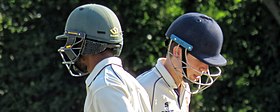 Typical cricket helmets in use. Sandwich Town CC v. MCC at Sandwich, Kent, England 219 (cropped).jpg