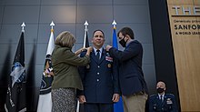 Tonia Shaw (left) and her son, Timothy Shaw (right), pin newly promoted Lt. Gen. Shaw during the general's promotion and transfer ceremony on November 23, 2020. Shaw receives third star, transfers to Space Force (1).jpg