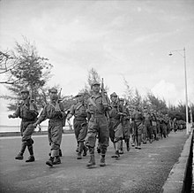 MPAJA guerrillas marching through the streets of Johor Bahru during their disbandment ceremony in December 1945. The British Reoccupation of Malaya SE5878.jpg