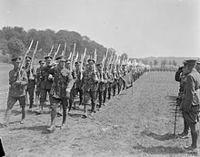 Men of the 2nd Battalion, Royal Sussex Regiment marching past Prince Arthur, Duke of Connaught, near Bruay, France, 1 July 1918 The Royal Visits To the Western Front, 1914-1918 Q10363.jpg