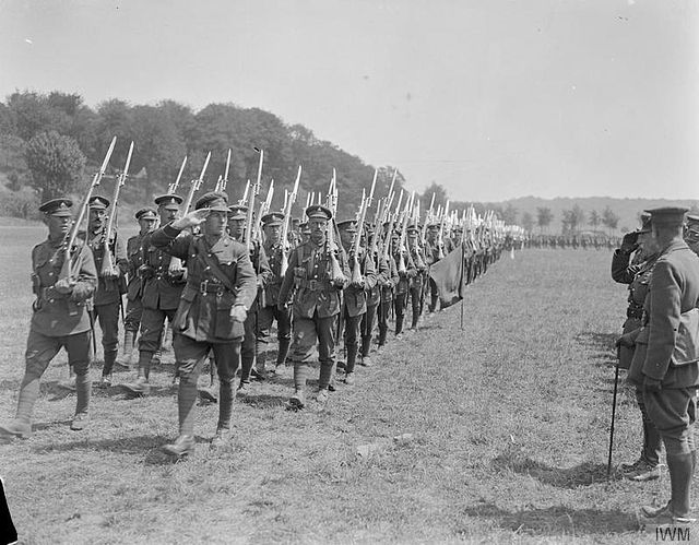 Men of the 2nd Battalion, Royal Sussex Regiment marching past Prince Arthur, Duke of Connaught, near Bruay, France, 1 July 1918