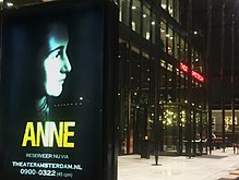 Theater Amsterdam, Amsterdam, the Netherlands. Exterior (front) of the building, with its logo visible on the right, and a poster for theatre production 'ANNE' on the left. Theater Amsterdam exterior with 'ANNE' poster.jpg
