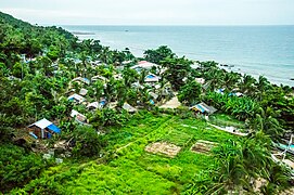 A community on a coastal area can be viewed from the top of the lighthouse